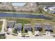 An aerial view of a property outlining the boundaries within a neighborhood alongside a scenic pond at 613 Waterford Ln, Westfield, IN 46074