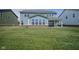 Large, newly seeded backyard with a view of the home's exterior at 613 Waterford Ln, Westfield, IN 46074