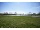 Beautiful backyard with healthy green grass and a large pond offering picturesque views and natural surroundings at 613 Waterford Ln, Westfield, IN 46074
