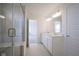 Bright primary bathroom features double vanity and glass shower at 613 Waterford Ln, Westfield, IN 46074