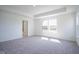 Bright primary bedroom featuring neutral carpet, tray ceiling and natural light at 613 Waterford Ln, Westfield, IN 46074