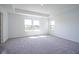 Spacious bedroom with tray ceiling, large windows and neutral carpet at 613 Waterford Ln, Westfield, IN 46074