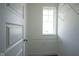 Walk-in closet features ample shelving and natural light at 613 Waterford Ln, Westfield, IN 46074