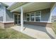 Covered back patio with brick foundation and view to the backyard at 613 Waterford Ln, Westfield, IN 46074