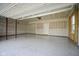 Spacious garage with epoxy floors, drywall, window and modern garage door at 613 Waterford Ln, Westfield, IN 46074