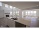 Spacious kitchen and living room with modern appliances and an open floor plan at 613 Waterford Ln, Westfield, IN 46074