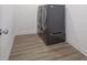Modern laundry room featuring luxury vinyl plank flooring and front load washer and dryer at 613 Waterford Ln, Westfield, IN 46074