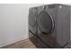Close up of front load washer and dryer in the laundry room at 613 Waterford Ln, Westfield, IN 46074