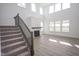 Spacious living room with hardwood floors, fireplace, and large windows offering natural light at 613 Waterford Ln, Westfield, IN 46074