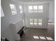 Open-concept living room features a fireplace, abundant natural light, and hardwood flooring at 613 Waterford Ln, Westfield, IN 46074