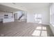 Open-concept living space featuring a kitchen, staircase, and sliding doors at 613 Waterford Ln, Westfield, IN 46074
