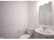 Clean and simple powder room featuring a pedestal sink and standard toilet at 613 Waterford Ln, Westfield, IN 46074