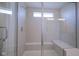 Modern tiled shower featuring glass door, rainfall shower head and built in shower seat at 613 Waterford Ln, Westfield, IN 46074
