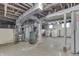Unfinished basement featuring exposed ductwork, utility connections and a laundry area at 620 S Irvington Ave, Indianapolis, IN 46219