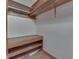 Closet with built-in shelving and wooden accents at 620 S Irvington Ave, Indianapolis, IN 46219