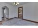 Cozy dining area with an archway leading to the kitchen at 620 S Irvington Ave, Indianapolis, IN 46219