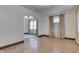 Bright living room with hardwood floors, an archway and neutral walls at 620 S Irvington Ave, Indianapolis, IN 46219