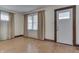 Inviting living room with hardwood floors, natural light, and a cozy atmosphere at 620 S Irvington Ave, Indianapolis, IN 46219