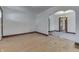 Spacious living room with hardwood floors and an archway to another room at 620 S Irvington Ave, Indianapolis, IN 46219