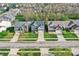 A neighborhood aerial shot shows multiple houses lined up with green lawns and tree-lined streets at 6650 W Black Tail Way, McCordsville, IN 46055