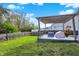 Charming backyard featuring lush lawn and wooden privacy fence, with a deck at 6650 W Black Tail Way, McCordsville, IN 46055