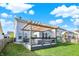 Spacious backyard featuring a deck with pergola, lawn, and a swing set at 6650 W Black Tail Way, McCordsville, IN 46055