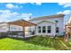 Lush backyard featuring a deck with pergola, lawn, and a swing set at 6650 W Black Tail Way, McCordsville, IN 46055