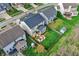 Aerial view of a fenced-in backyard featuring a deck with pergola, play set, and green lawn at 6650 W Black Tail Way, McCordsville, IN 46055