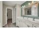 Updated bathroom featuring a double vanity, and framed mirror at 6650 W Black Tail Way, McCordsville, IN 46055