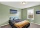 Light and airy bedroom with a window, beach themed decor and neutral carpet at 6650 W Black Tail Way, McCordsville, IN 46055