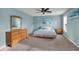 Spacious bedroom with beach themed décor, neutral carpet and ample natural light at 6650 W Black Tail Way, McCordsville, IN 46055