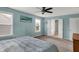 Inviting bedroom featuring lots of natural light, ceiling fan, and access to the bathroom at 6650 W Black Tail Way, McCordsville, IN 46055
