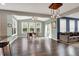Bright dining area with hardwood floors and modern light fixture at 6650 W Black Tail Way, McCordsville, IN 46055