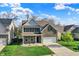 Two-story house with brick and siding exterior, attached garage, and a well-maintained front yard at 6650 W Black Tail Way, McCordsville, IN 46055