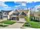 Charming two-story home featuring a brick facade, covered porch, and well-manicured lawn at 6650 W Black Tail Way, McCordsville, IN 46055