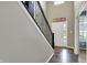 Bright foyer with hardwood floors, featuring a staircase with elegant iron railing at 6650 W Black Tail Way, McCordsville, IN 46055