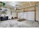 Spacious garage with ample storage, overhead lighting, and a clean concrete floor at 6650 W Black Tail Way, McCordsville, IN 46055