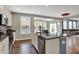 Open kitchen featuring stainless steel appliances, granite countertops, and an island with a sink at 6650 W Black Tail Way, McCordsville, IN 46055