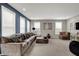 Spacious living room with bright windows and stylish decor, perfect for relaxation at 6650 W Black Tail Way, McCordsville, IN 46055