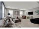 Inviting living room featuring plush seating and ample natural light, ideal for gatherings at 6650 W Black Tail Way, McCordsville, IN 46055