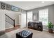 Inviting living room with an open layout, featuring carpeted floors and neutral wall colors at 6650 W Black Tail Way, McCordsville, IN 46055