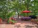 Outdoor deck with a picnic table, grill, and lake views, ideal for entertaining or relaxing at 7037 Indian Lake W Blvd, Indianapolis, IN 46236
