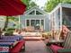 Inviting backyard deck with patio furniture, greenery, and views of the home at 7037 Indian Lake W Blvd, Indianapolis, IN 46236