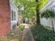 A tranquil walkway leads to a charming backyard retreat with lush landscaping at 7037 Indian Lake W Blvd, Indianapolis, IN 46236