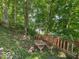 Outdoor picnic area near lake with charming picnic table and benches at 7037 Indian Lake W Blvd, Indianapolis, IN 46236