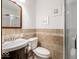 Modern bathroom with a glass shower enclosure, stylish tile work, and sleek fixtures at 7037 Indian Lake W Blvd, Indianapolis, IN 46236