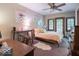 Cozy bedroom with a sunny window, desk, and vintage decor with light color walls at 7037 Indian Lake W Blvd, Indianapolis, IN 46236