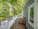 Relaxing deck features wooden chairs and a view of the lush green surroundings at 7037 Indian Lake W Blvd, Indianapolis, IN 46236
