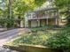 Charming home featuring a lovely front yard, stone facade, and convenient attached garage at 7037 Indian Lake W Blvd, Indianapolis, IN 46236