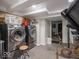 Functional laundry area with modern appliances, ample storage, and room for a home gym at 7037 Indian Lake W Blvd, Indianapolis, IN 46236